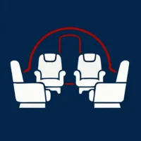 Eine schematische Grafik auf dunkelblauem Hintergrund zeigt vier weiße Sessel, die in einer Club-Sitzordnung (vis-à-vis) angeordnet sind. Im Hintergrund ist die rote Umrisslinie eines Flugzeugrumpf-Querschnitts mit einer angedeuteten Türöffnung zu sehen. Die flächige Illustration symbolisiert die komfortable Kabinenausstattung und Bestuhlung bei Finow Air Service.